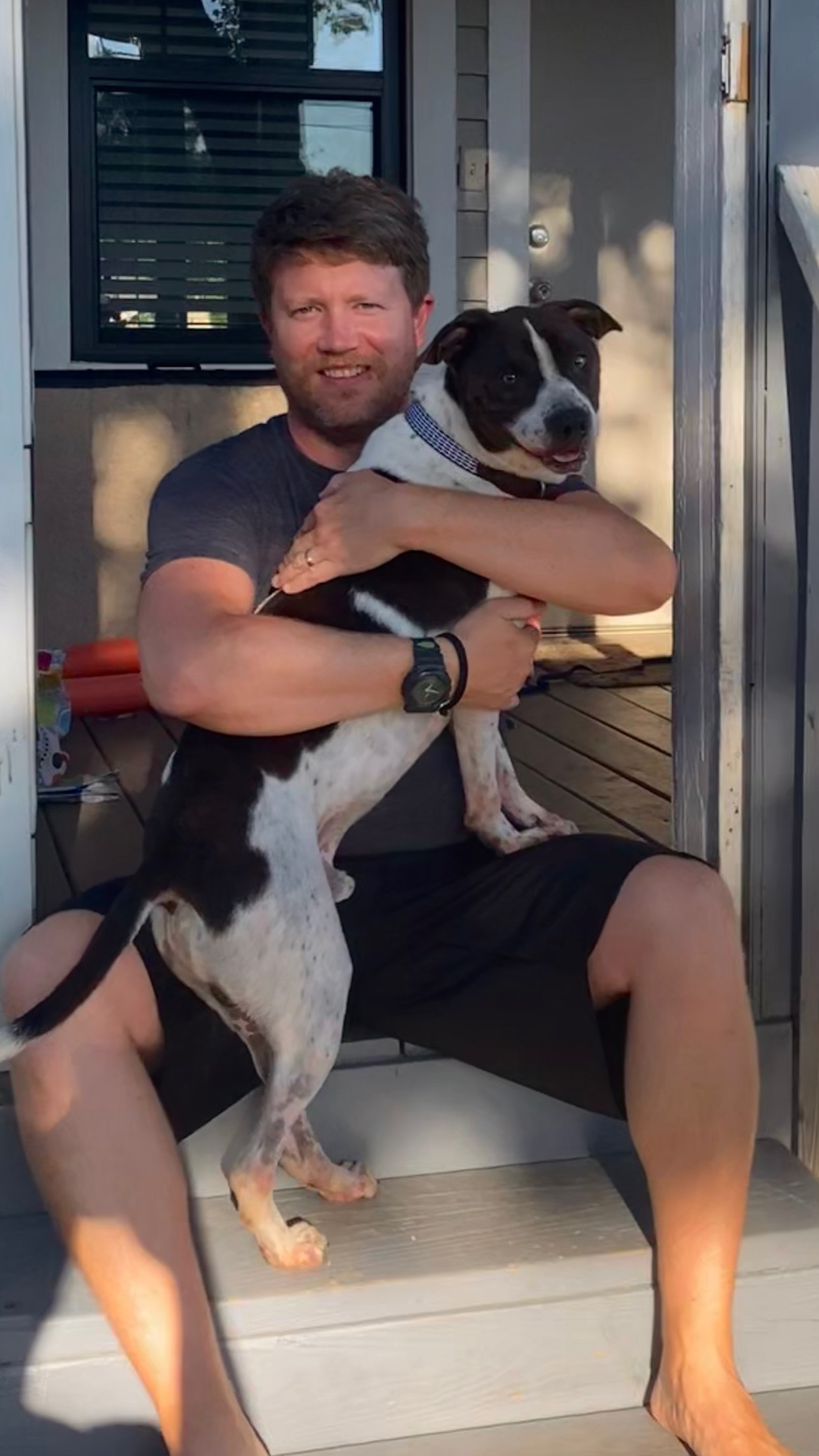 Jeff Perry holding his dog